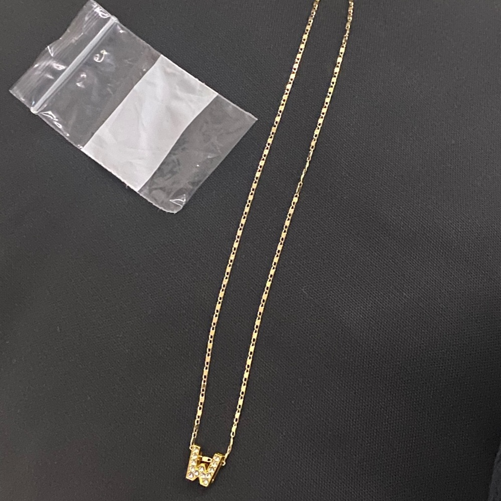 initial gold plated necklaces. letters: W,N only. one of each.